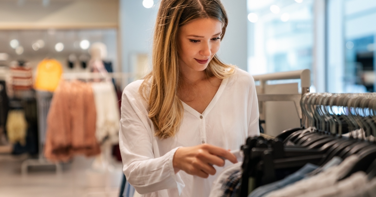 Young woman buying new clothes