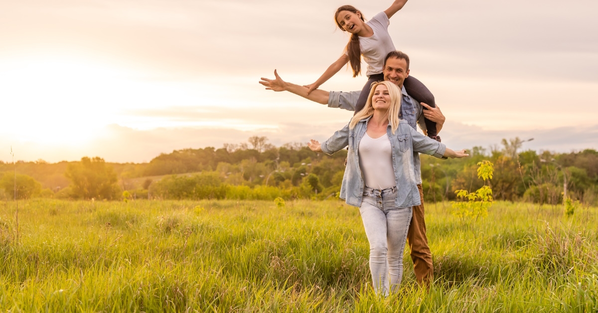 family enjoying while roaming in field