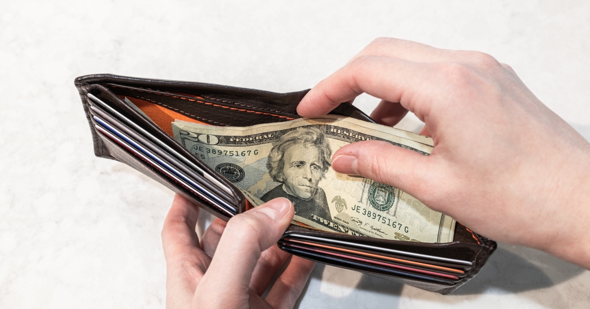 banknote inside brown wallet