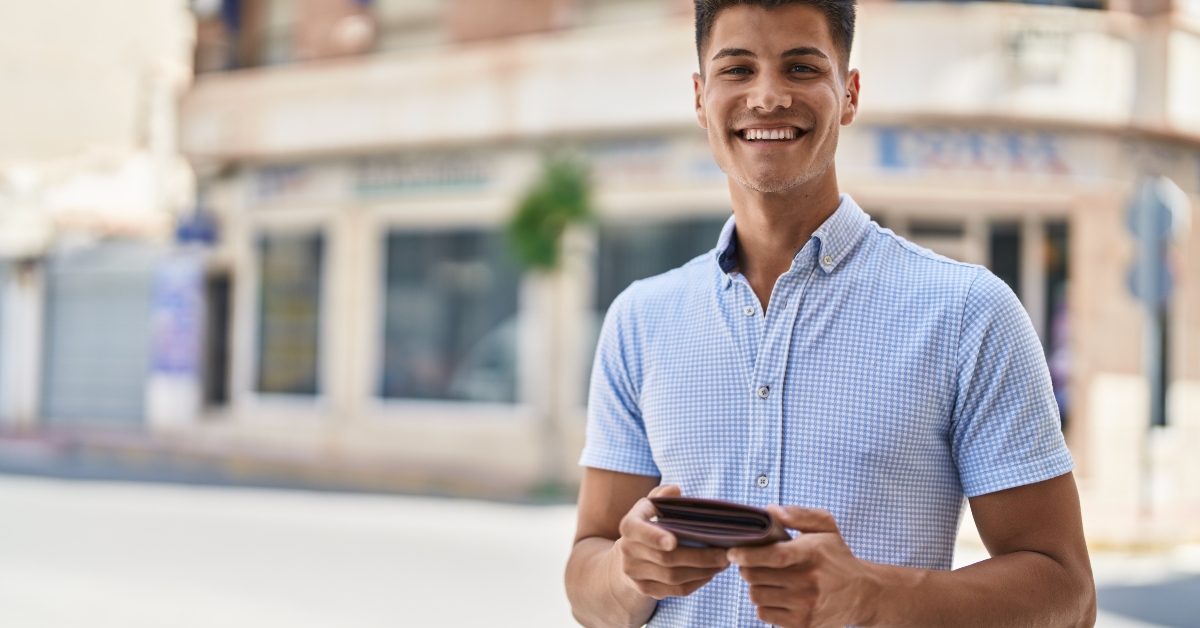 man holding leather wallet