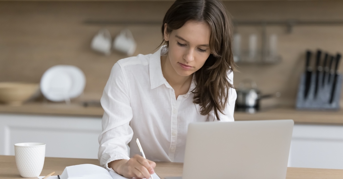 Young woman takes notes