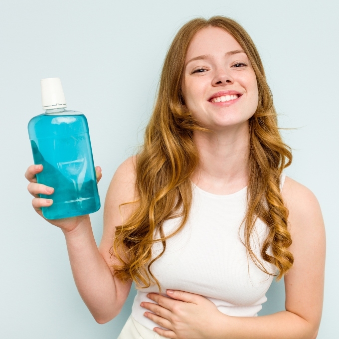 A girl with mouthwash