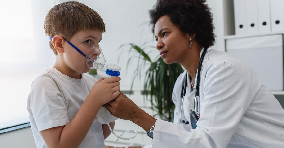 Someone helping with a nebulizer