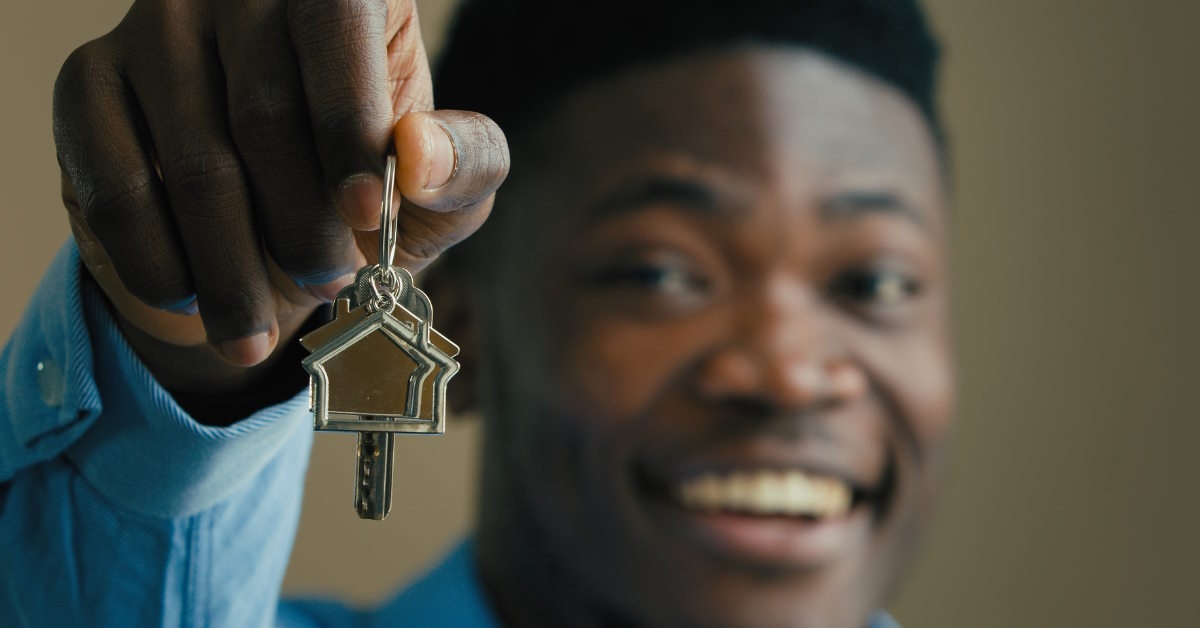 Happy person holding new keys