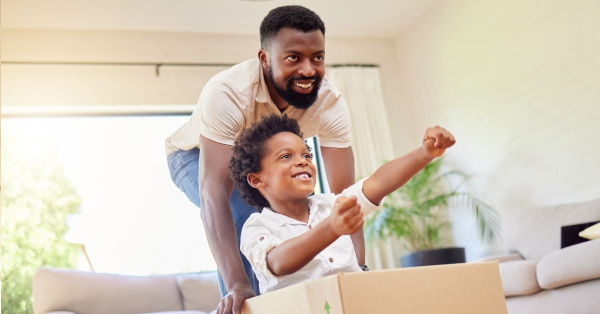 african american father playing with son