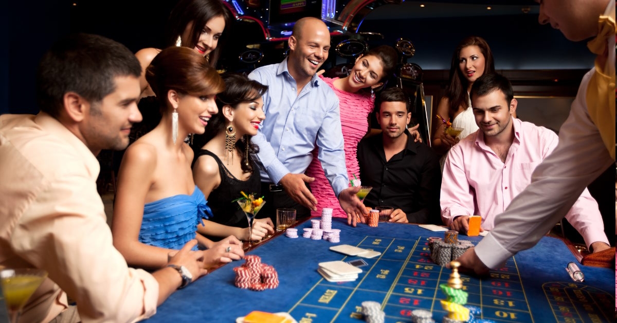 happy friends playing roulette in casino