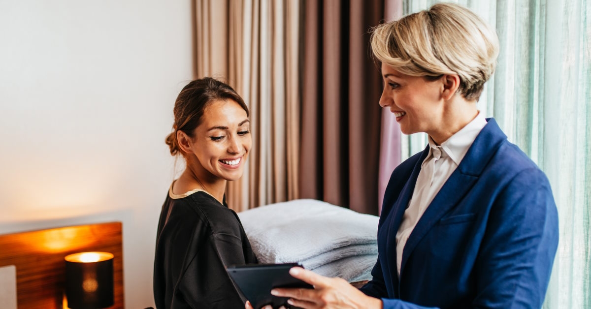 hotel manager showing work to maid