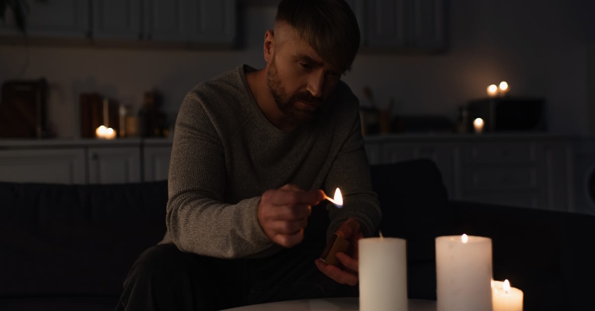 Person lighting candles