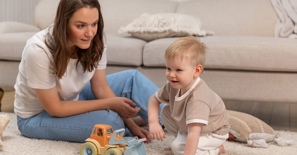 mother playing with baby boy