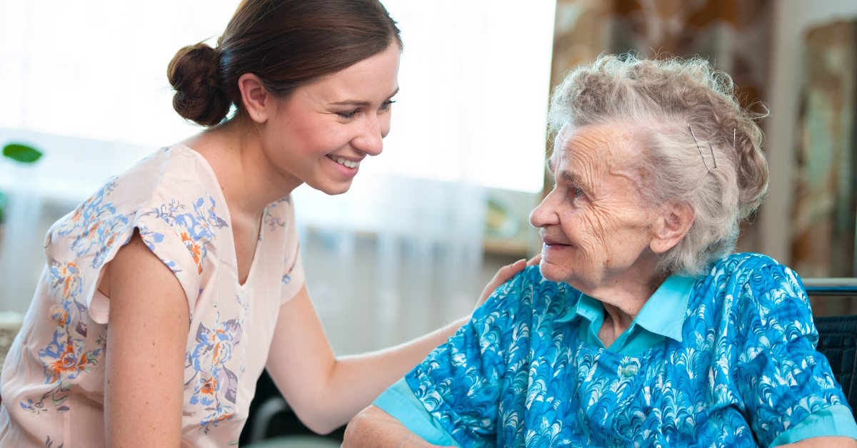 senior woman happy with caregiver