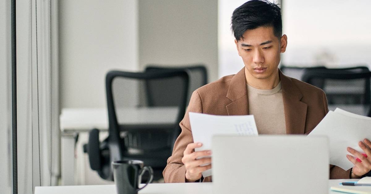 Man looking at paperwork