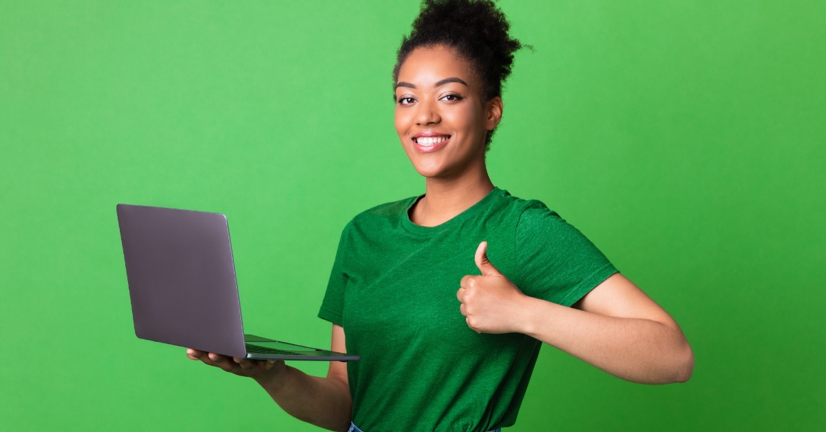 Person doing thumbs up with laptop
