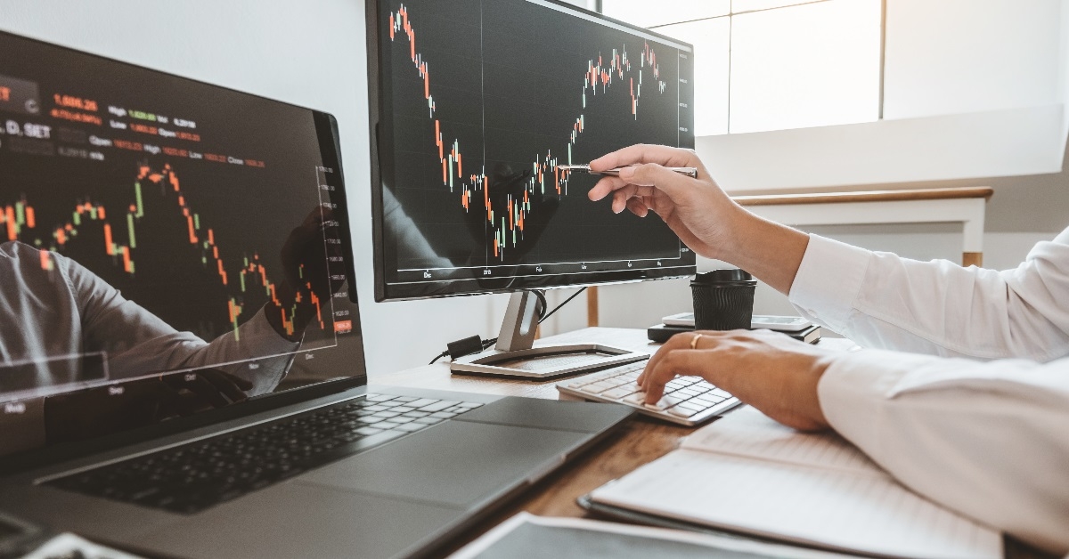 Businessman analyzing statistical data on laptop