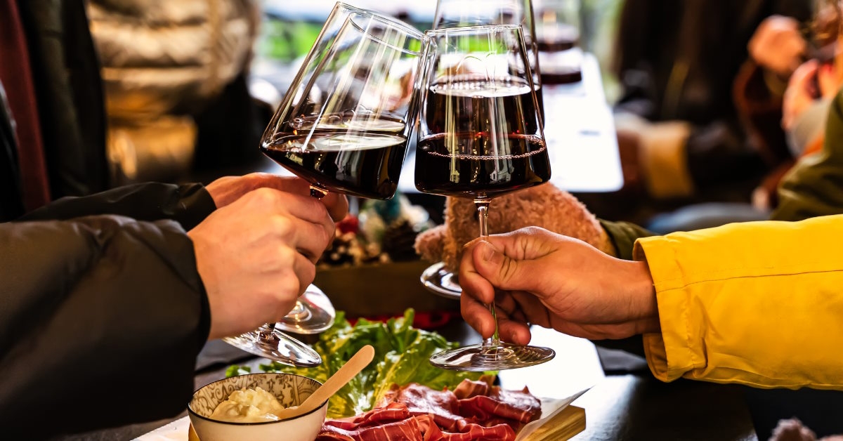 Friends cheers with wine glasses