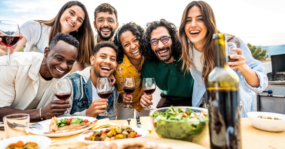 friends posing at rooftop bbq party