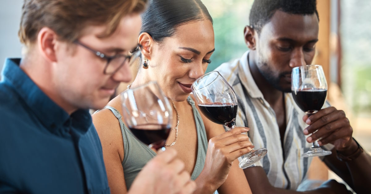 Friends tasting wine