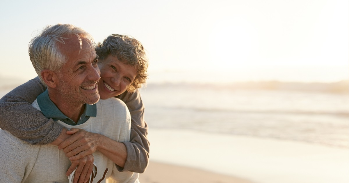 romantic senior couple having fun at the beach.