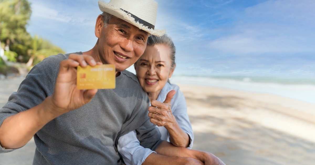 couple displaying a credit card