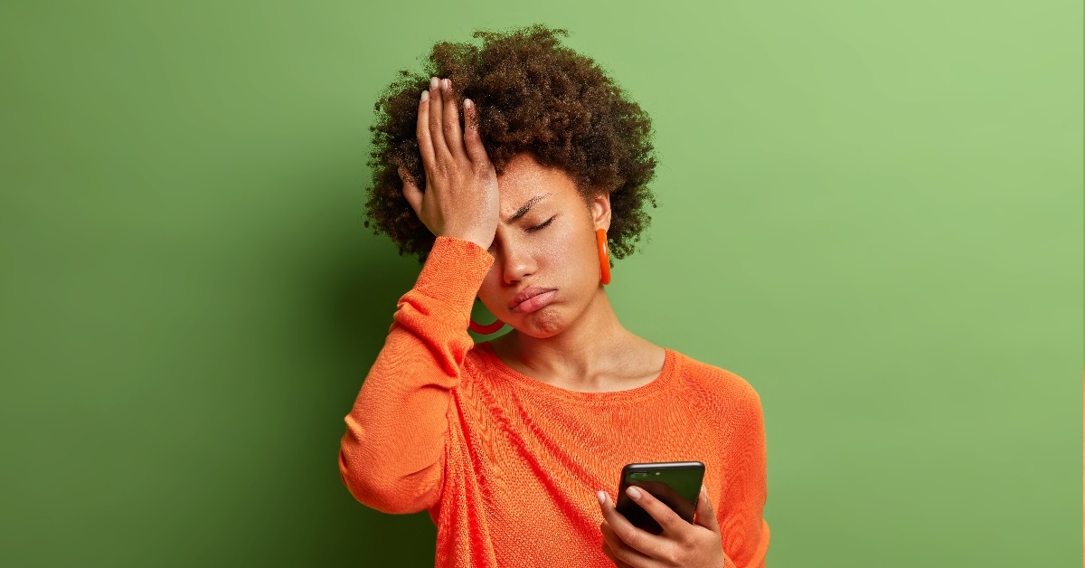 Woman facepalming in frustration