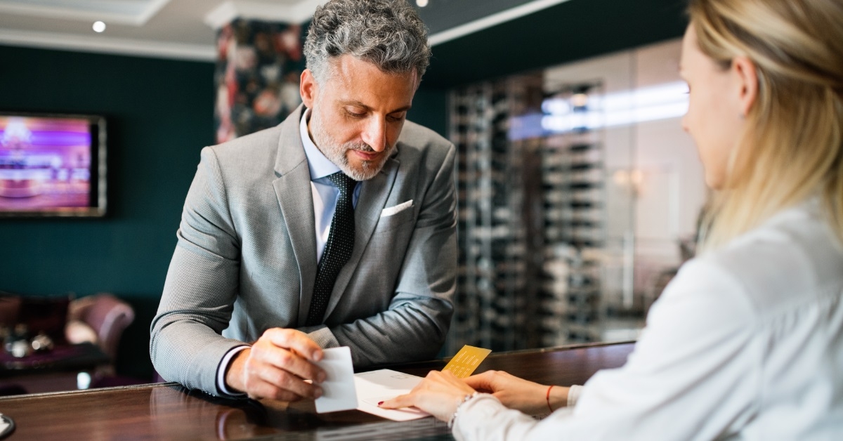 Man checking in to a hotel