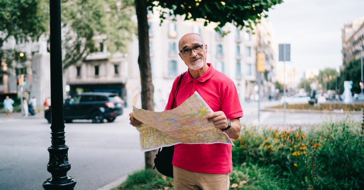 man holding location paper map