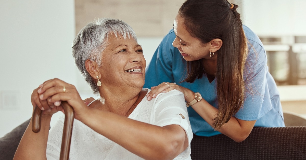 Healthcare worker aiding a senior lady