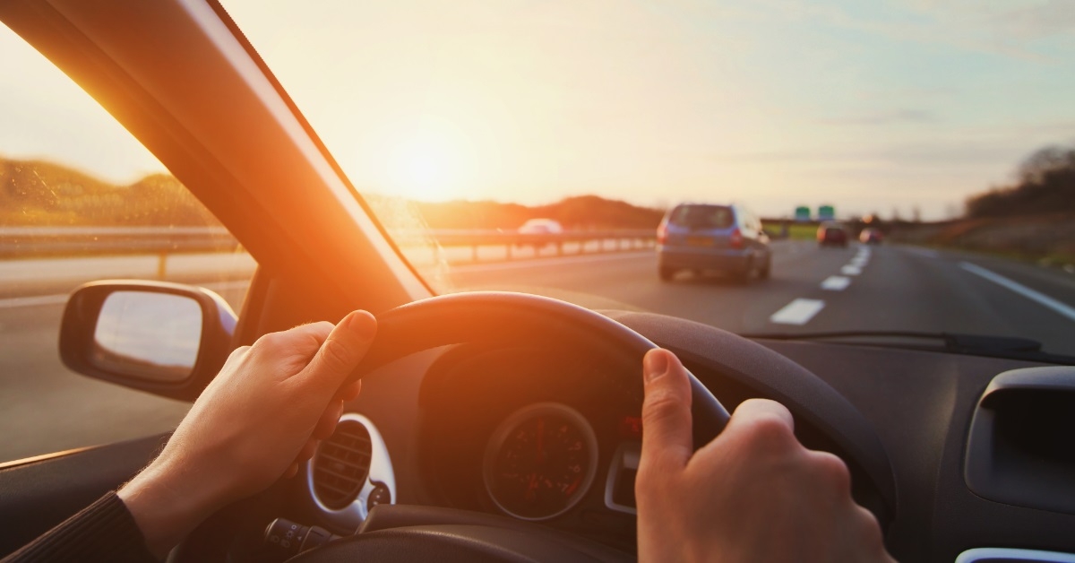 Driver hands on steering wheel
