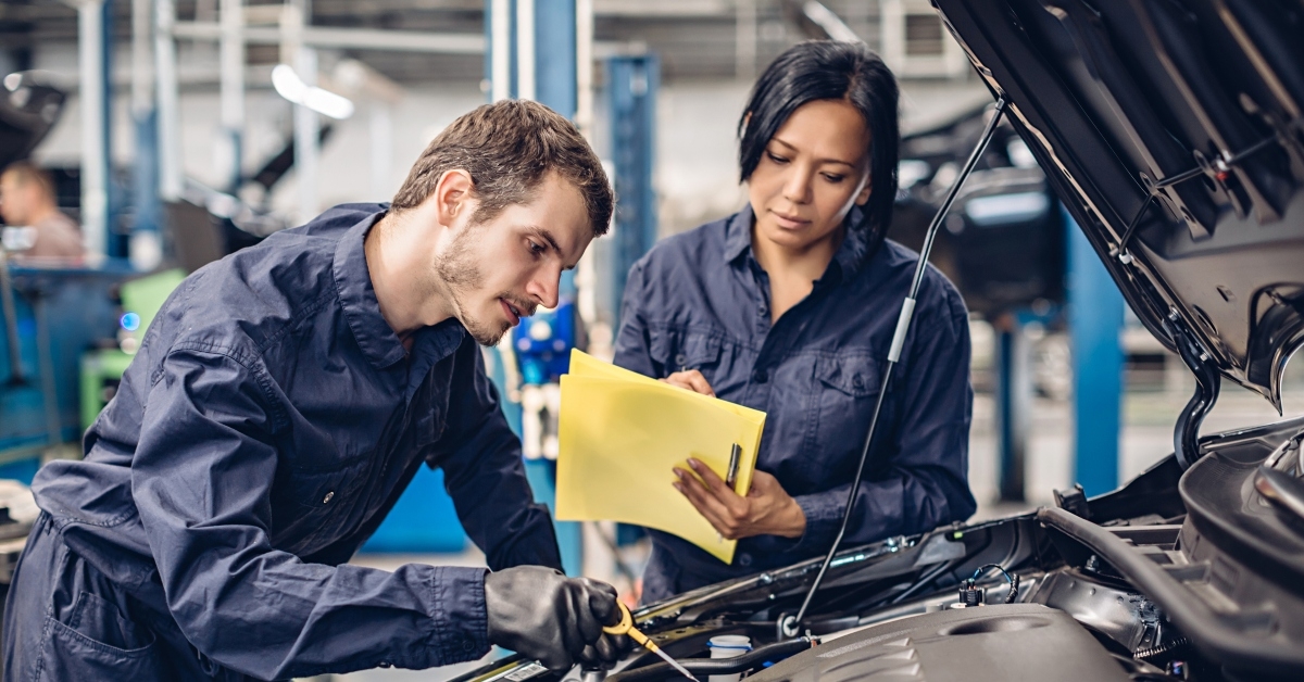 Mechanics checking engine