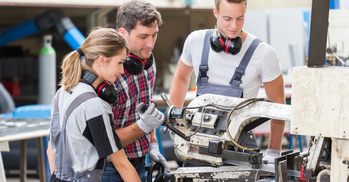 young apprentice with professional metallurgist