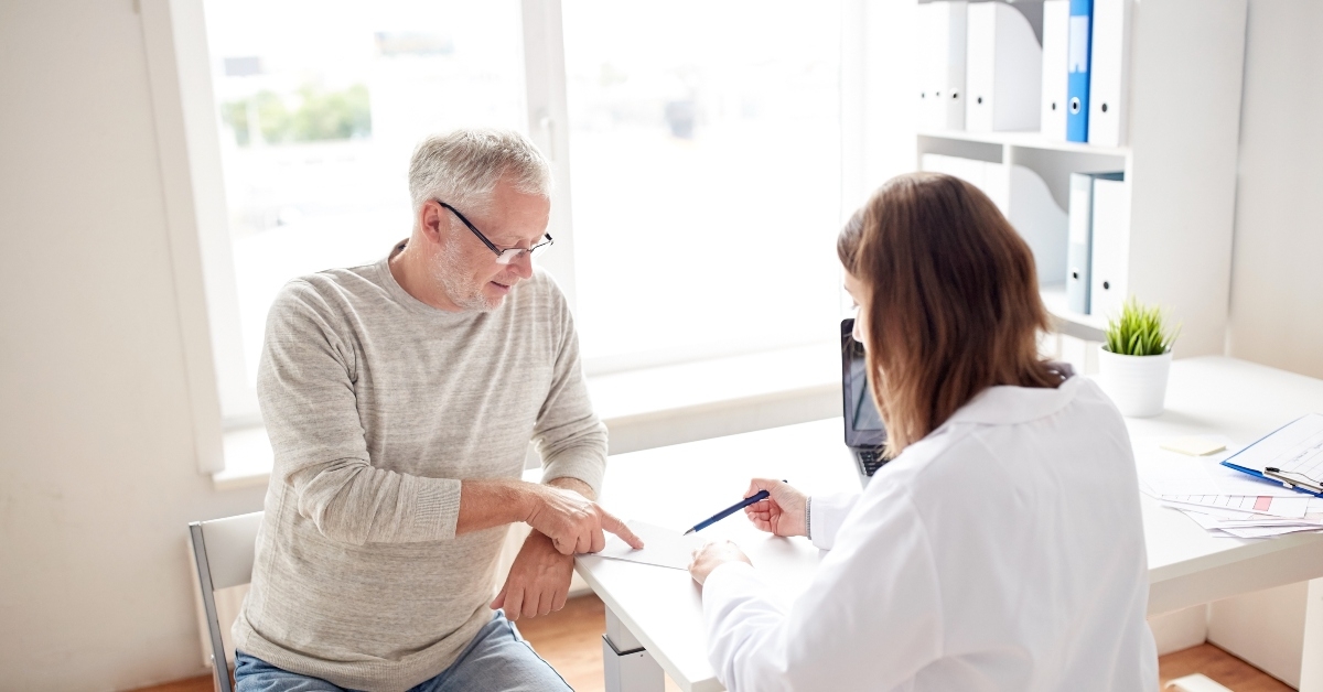 man and doctor with prescription