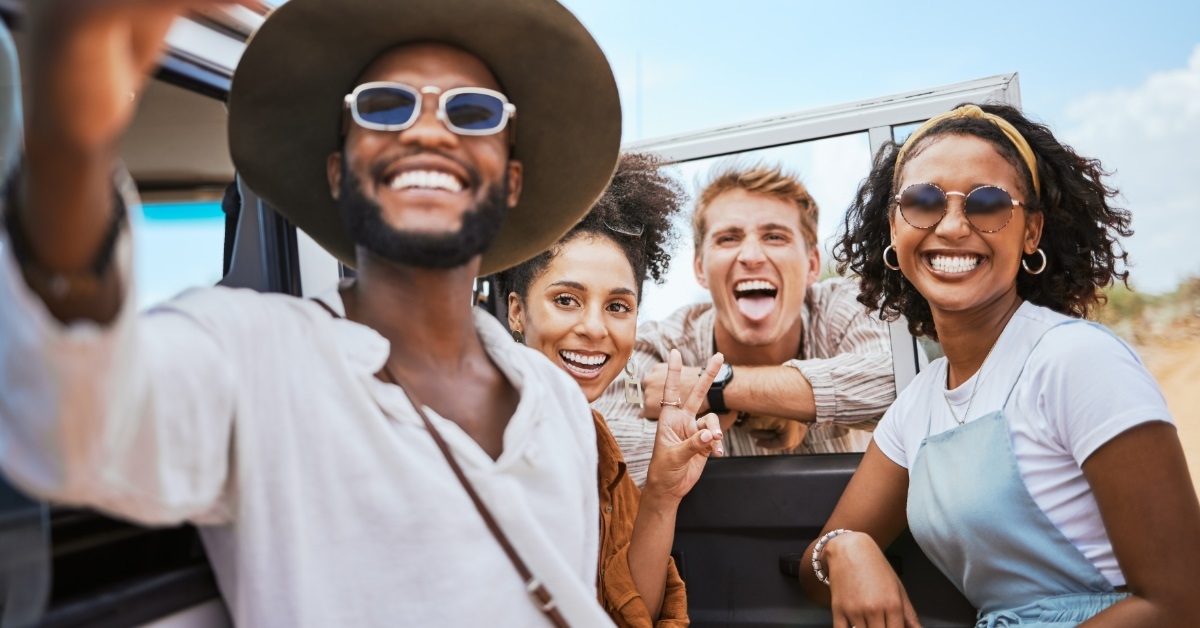 multi ethnic friends posing for selfie 