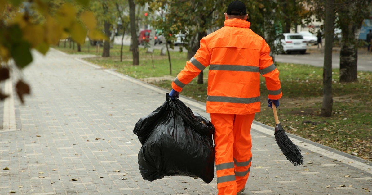 street cleaner with broom on street