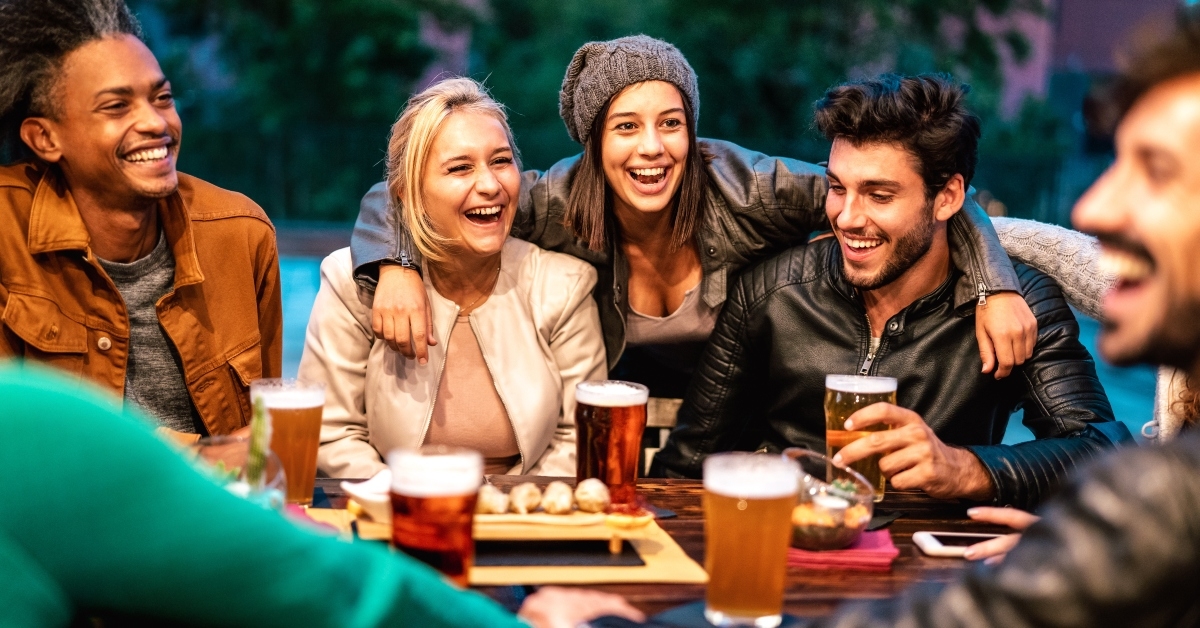 friends drinking beer at brewery bar