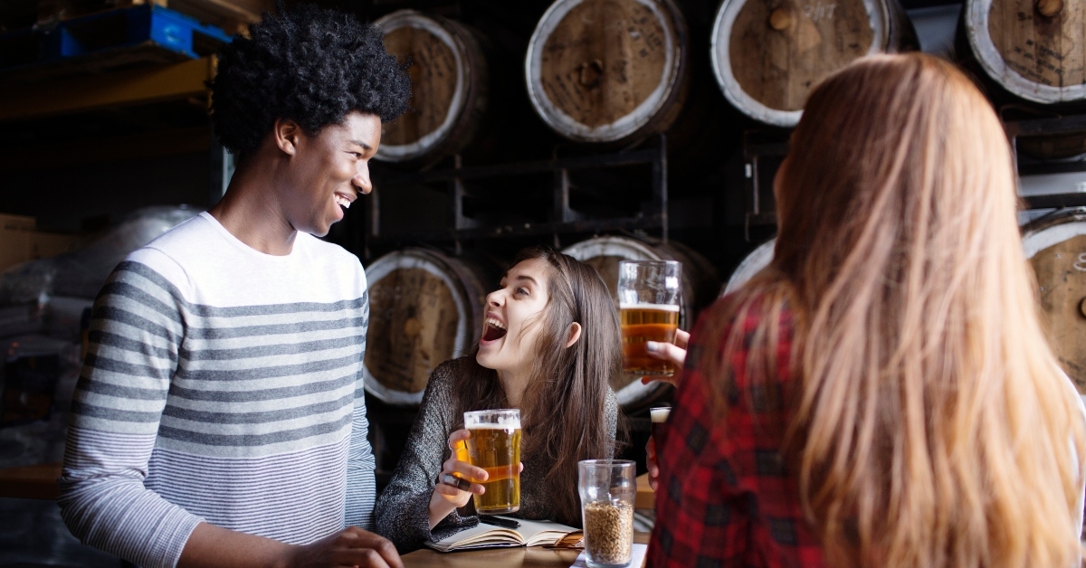friends enjoying beer in brewery