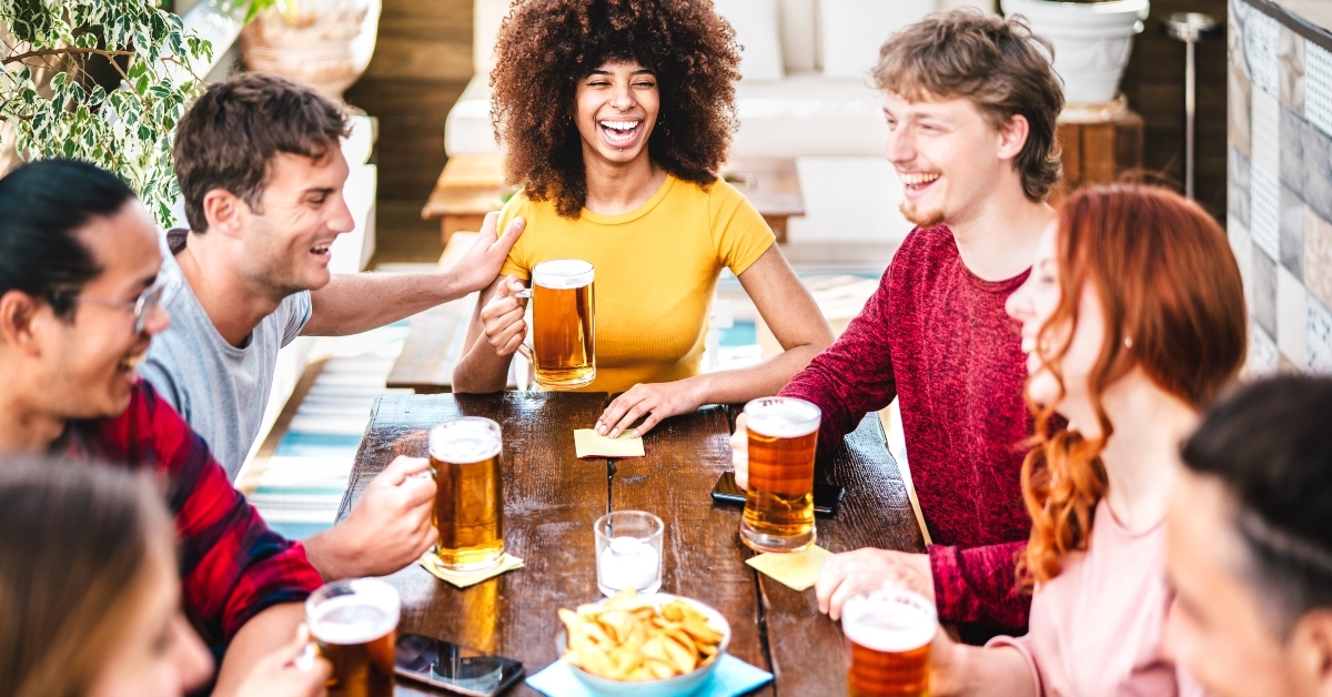 people drinking beer at brewery bar