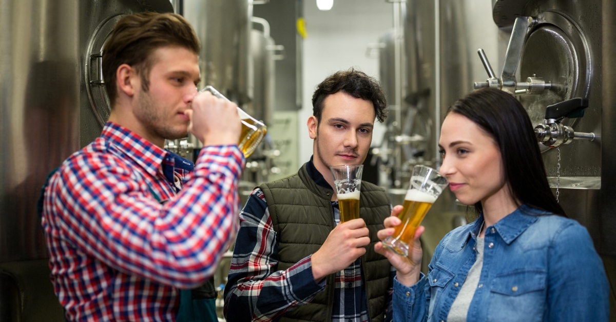 brewers testing beer at brewery factory