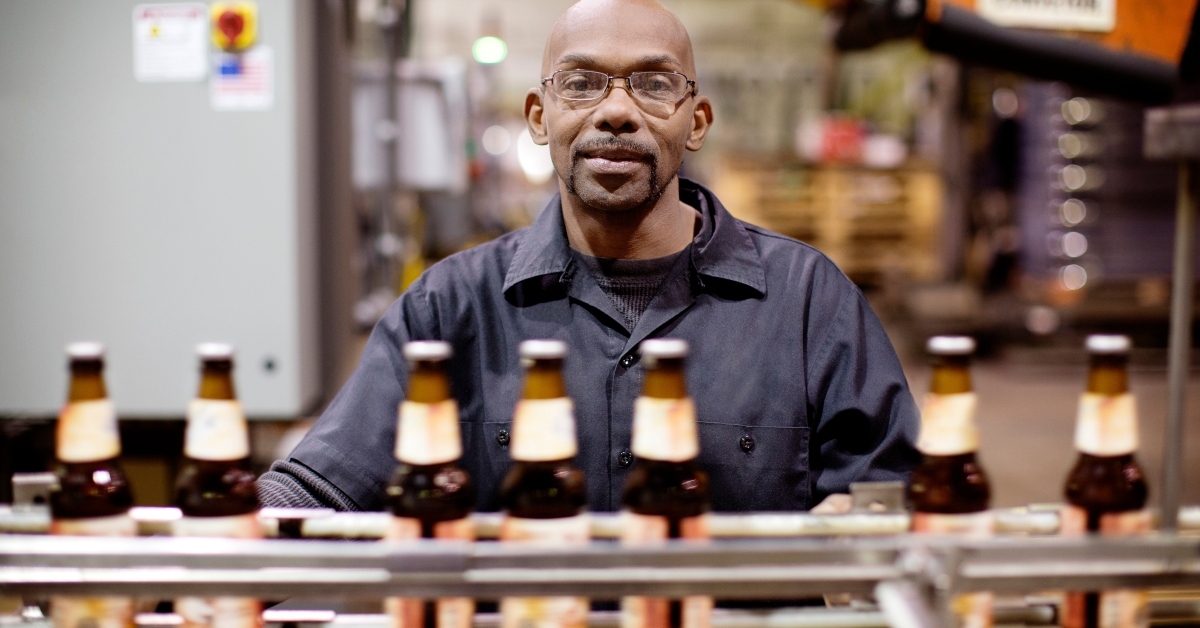 brewery worker at assembly line