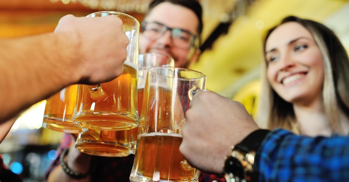 friends drink beer and smile