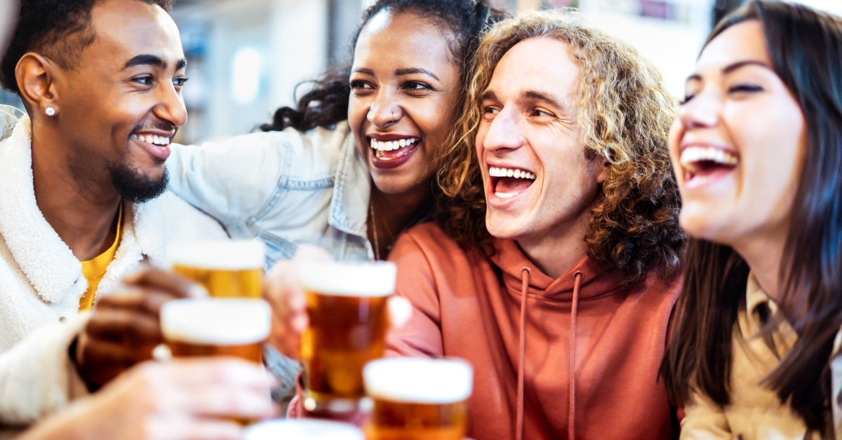 friends drinking and toasting beer