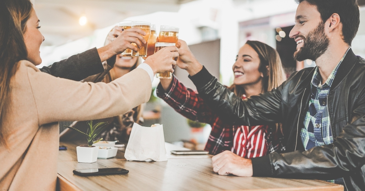 people cheering at bar restaurant