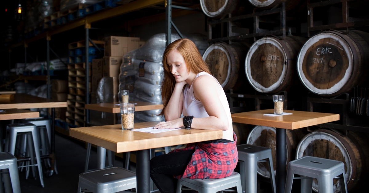 woman sitting in brewery