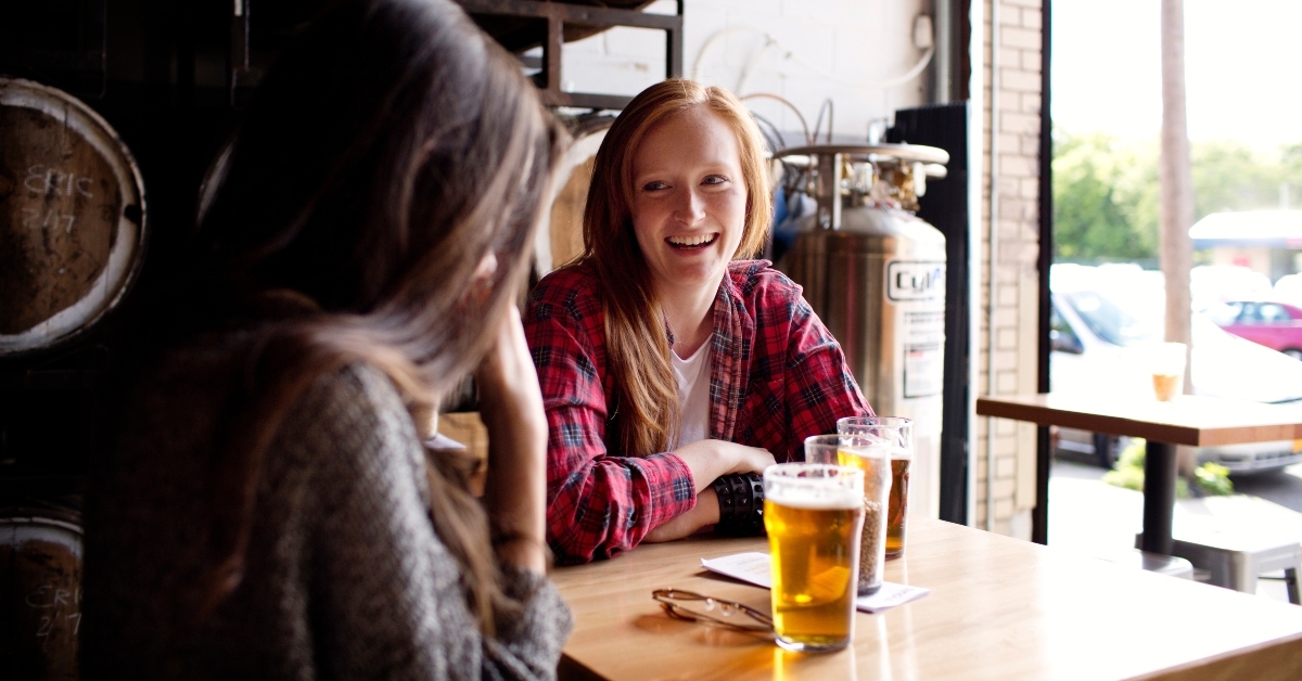 women sitting in brewery