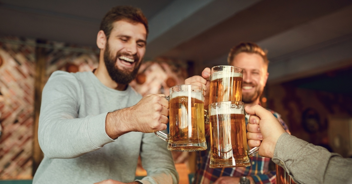 friends clinking glasses with beer