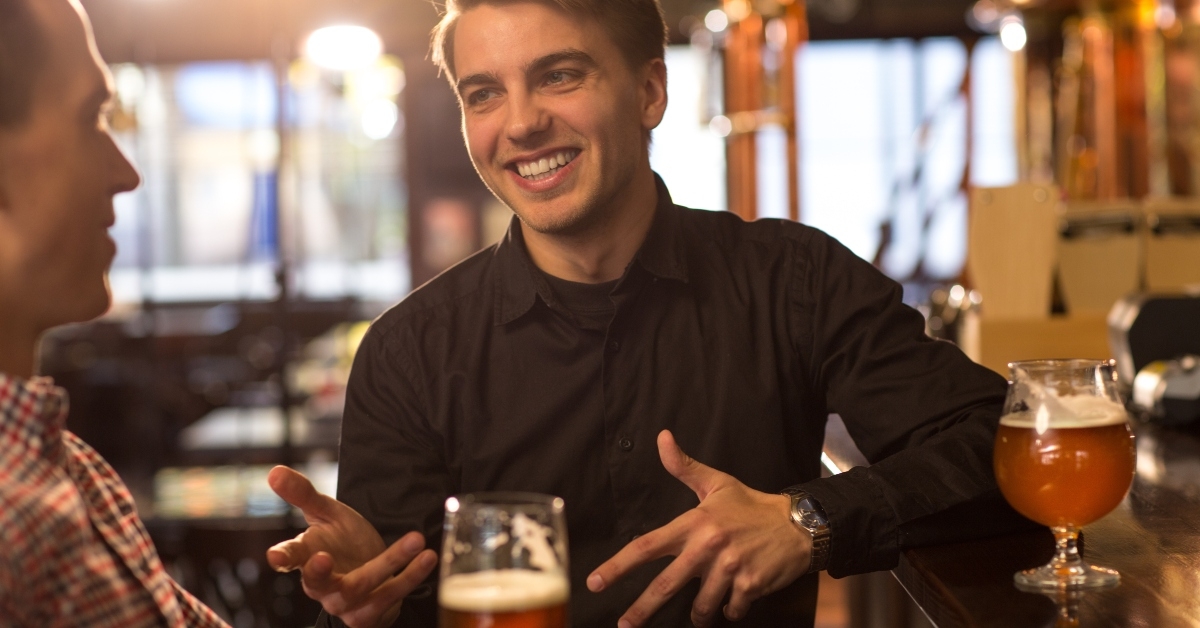 men sitting at bar counter