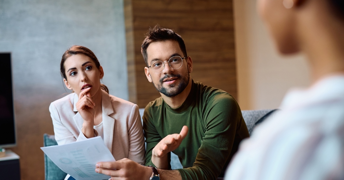 couple communicating with insurance agent