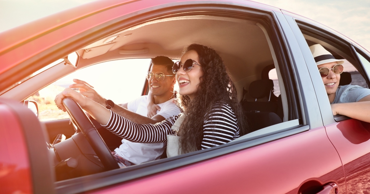 friends together in car on road trip