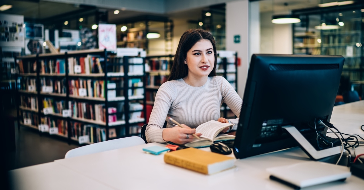 using computer while studying in library
