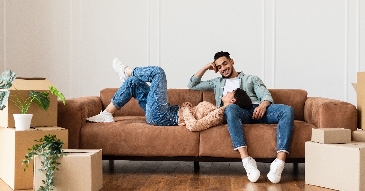 couple relaxing after moving to home