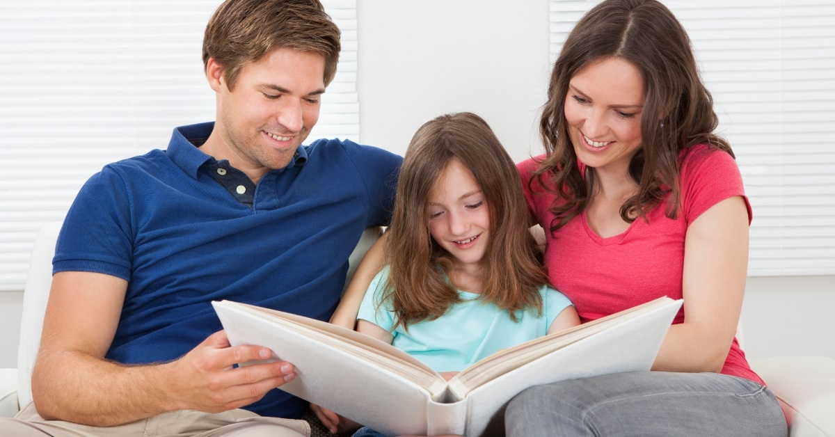 happy family going through photo album