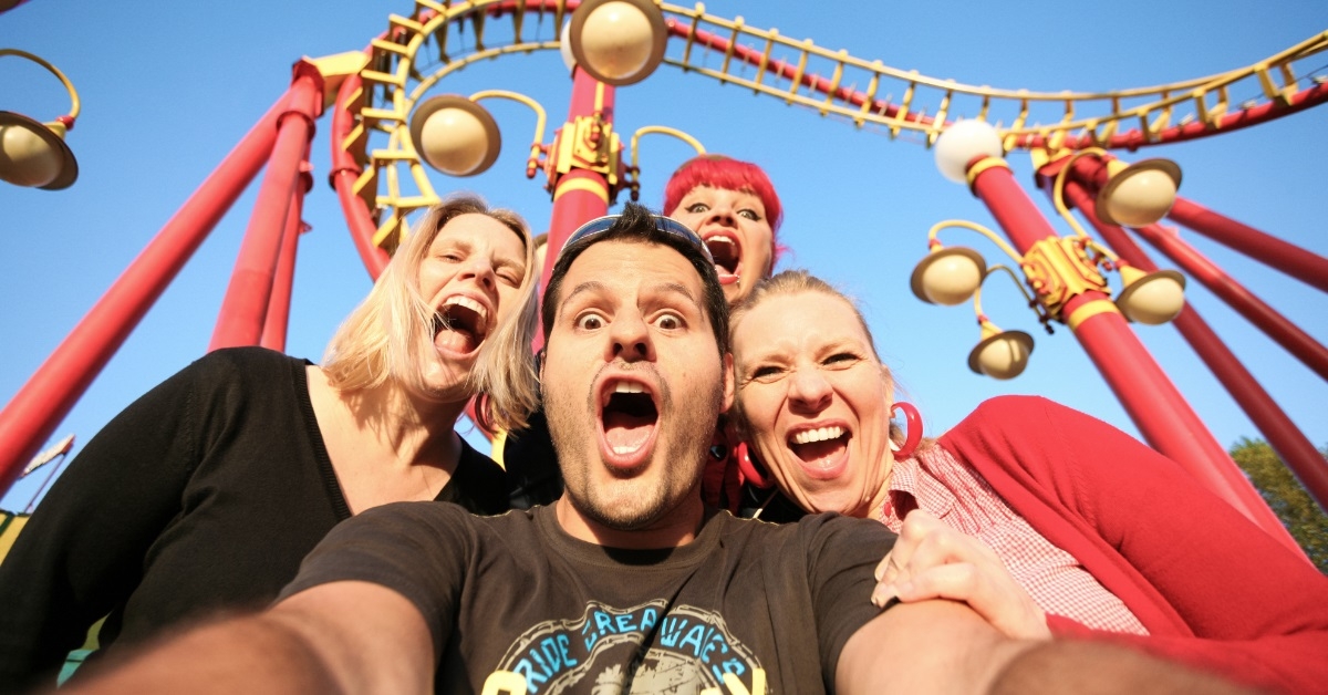 friends posing at amusement park